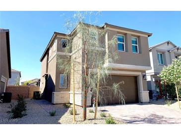 Charming two-story home with neutral paint, landscaped yard, and attached two-car garage at 6507 Dove Point Pl, Las Vegas, NV 89130