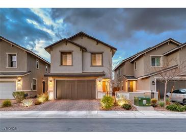 Charming two-story home with a brick driveway and well-manicured landscaping at 122 Cabaletta Ln, Henderson, NV 89015