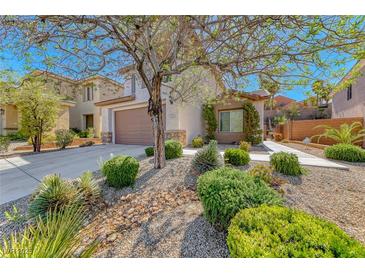 Charming home featuring low-maintenance desert landscaping and a well-kept lawn at 2528 Flodden St, Henderson, NV 89044