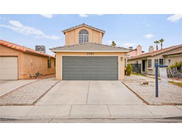 Charming home featuring a two-car garage and low-maintenance landscaping at 2793 Sandyfalls Way, Las Vegas, NV 89142