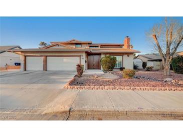 Charming single-Gathering home featuring a three-car garage and manicured landscaping at 2916 W Oakey Blvd, Las Vegas, NV 89102