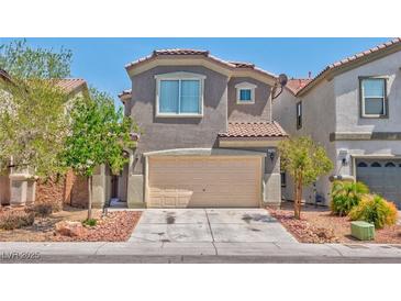 Charming two-story home with a two-car garage and well-maintained landscaping at 3958 Blushing Hearts Rd, Las Vegas, NV 89115