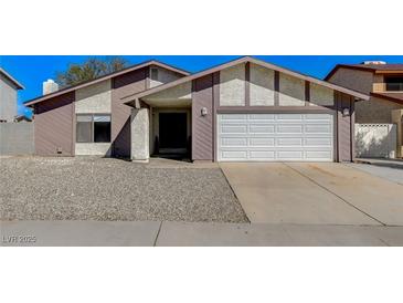 Charming single-story home with a two-car garage and low maintenance desert landscaping at 6782 Bonillo Dr, Las Vegas, NV 89103
