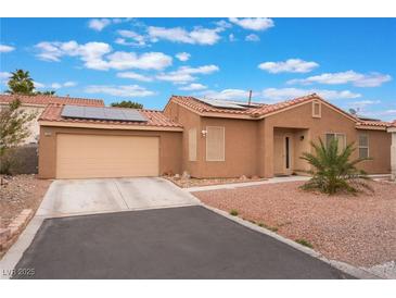 Charming single-story home with desert landscaping, solar panels, and a two-car garage at 7904 Mountain Point Ave, Las Vegas, NV 89131