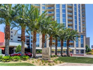 Beautiful high-rise building exterior with professional landscaping and manicured lawn, with mature palms in Las Vegas at 200 W Sahara Ave # 3009, Las Vegas, NV 89102