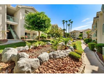 Beautifully landscaped grounds with mature trees, rocks and walking paths create a welcoming and serene community environment at 3550 Bay Sands Dr # 3020, Laughlin, NV 89029