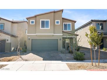 Inviting two-story home featuring a two-car garage and low-maintenance landscaping at 3807 Andorian Ave, North Las Vegas, NV 89084