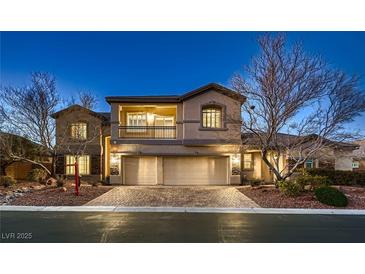 Elegant two-story home featuring a three-car garage, balcony, and well-maintained landscaping at 3892 Pasilla Ave, Las Vegas, NV 89118
