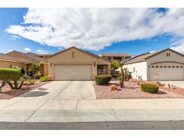 Charming single-story home with a two-car garage and low-maintenance landscaping at 563 Cypress Gardens Pl, Henderson, NV 89012