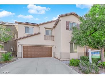 Two-story home featuring a two-car garage and manicured landscaping at 8036 Maple Park St, Las Vegas, NV 89131