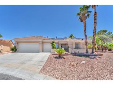 Charming single-story home featuring a three-car garage and low-maintenance desert landscaping at 1596 Fieldbrook St, Henderson, NV 89052