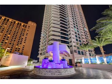 Striking high-rise building exterior featuring a grand entrance with a water feature and lush landscaping at 2700 Las Vegas Blvd # 3507, Las Vegas, NV 89109