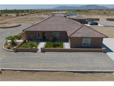 Charming single-story home featuring a tile roof and a well-maintained front yard with tasteful landscaping at 3181 W Bell Vista Ave # 2, Pahrump, NV 89060