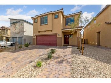 Charming two-story home featuring a paver driveway and attached two-car garage at 3835 Berenices Ave, North Las Vegas, NV 89084