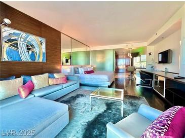 Bright living room featuring modern furniture and a large abstract art piece at 4381 W Flamingo Rd # 12304, Las Vegas, NV 89103