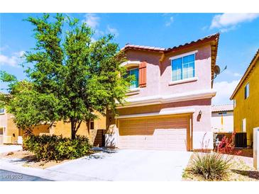 Charming two-story home featuring a two-car garage and mature landscaping at 5040 Copperlyn St, Las Vegas, NV 89122