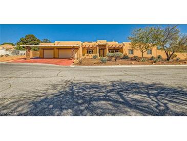 Charming single-story home with a two-car garage and desert landscaping at 2201 Rosanna St, Las Vegas, NV 89117