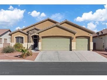 Charming single-story home featuring a two-car garage and desert landscaping at 4632 Cantina Rey St, North Las Vegas, NV 89081