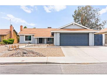 Charming single-story home with a two-car garage and low-maintenance front yard landscaping at 6155 W Twain Ave, Las Vegas, NV 89103