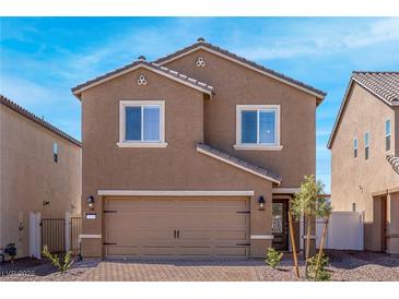 Charming two-story home featuring a brick driveway, two-car garage, and inviting front entryway at 6246 Blood Lily Ave, Las Vegas, NV 89122