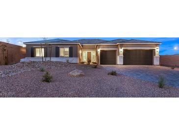 Beautiful single-story home with two-car garage and desert landscaping at 9930 Zakos Ct, Las Vegas, NV 89149