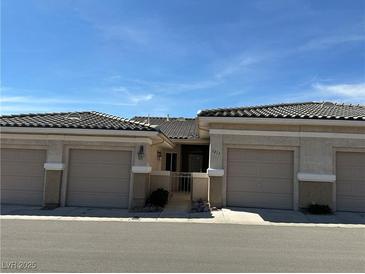 Charming home featuring a neutral stucco exterior, tile roof, and a well-maintained, private front entrance at 3213 Partridge Run St, Laughlin, NV 89029