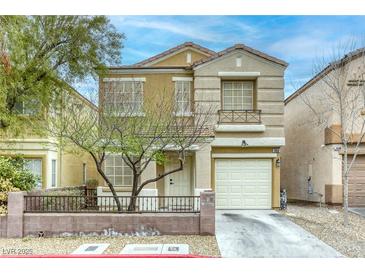 Charming two-story home featuring a well-manicured lawn, desert landscaping and a single-car garage at 3650 Mcmurty Ct, Las Vegas, NV 89129