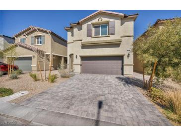 Attractive two-story home with a stone-paved driveway and attached two-car garage at 3760 Seyfert Ave, North Las Vegas, NV 89084