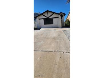 Charming home with a driveway and unique architectural details in the front at 503 Crony Ave, Henderson, NV 89011