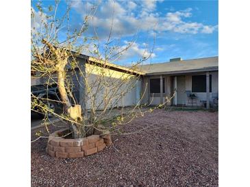 Charming single-story home with low-maintenance rock landscaping and mature tree in the front yard at 510 Holick Ave, Henderson, NV 89011