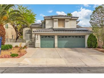 Charming two-story home with a three-car garage and well-maintained landscaping at 6 Desert Dawn Ln, Henderson, NV 89074