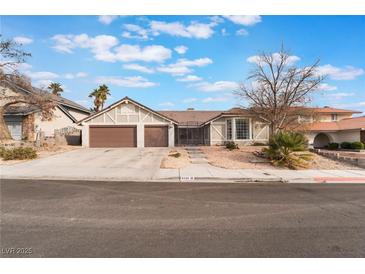 Charming single-story home with a two-car garage and well-maintained front yard landscaping at 6320 Vicuna Dr, Las Vegas, NV 89146