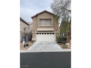 Two-story home featuring a neutral color palette, two-car garage, and low maintenance landscaping at 7936 Dexter Falls St, Las Vegas, NV 89149