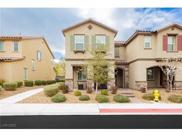 Charming two-story home featuring a well-manicured lawn, desert landscaping and neutral colors at 2871 Cabrillo Terrace St, Henderson, NV 89044