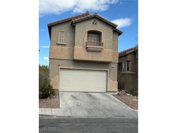 Two story home featuring a two car garage and stucco exterior at 3844 Hollycroft Dr, North Las Vegas, NV 89081