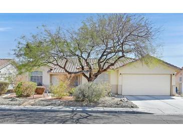 Charming single-story home with desert landscaping, tiled roof and attached two-car garage in a quiet neighborhood at 6151 Naha Port Ave, Las Vegas, NV 89110