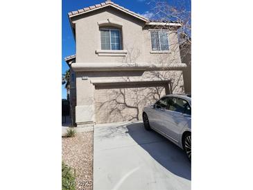 Charming home featuring an attached two car garage and well-maintained landscaping at 10524 Congaree St, Las Vegas, NV 89141