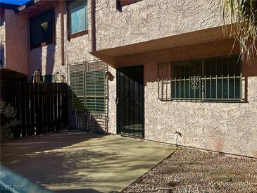Charming townhome exterior with security door and windows at 4338 Caliente St # 15, Las Vegas, NV 89119