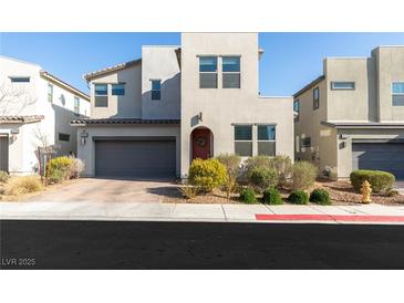 Contemporary two-story home with a two-car garage and desert landscaping at 524 Grand Cascade Pl, North Las Vegas, NV 89084