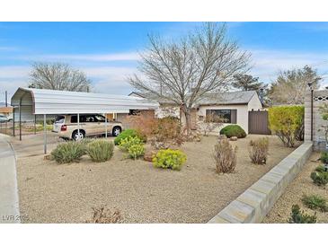 Charming single-story home featuring a covered parking area and desert landscaping for low maintenance at 657 Burton St, Henderson, NV 89015