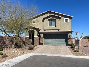 Charming two-story home featuring desert landscaping, a two-car garage, and a welcoming front entrance at 22 Kaku Ridge Way, Las Vegas, NV 89183