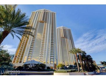 Striking high-rise condo towers with modern architectural details and lush landscaping against a clear blue sky at 125 E Harmon Ave # 1620, Las Vegas, NV 89109