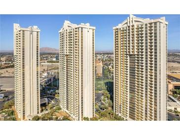 High-rise condo buildings featuring multiple floors, architectural details, and located in a vibrant urban setting at 135 E Harmon Ave # 221, Las Vegas, NV 89109
