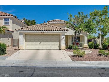 Charming single-story home with desert landscaping and a two-car garage at 2024 Riva Del Garda Pl, Las Vegas, NV 89134