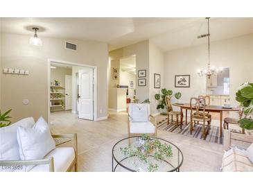 Inviting living room featuring neutral tones, stylish furnishings and an open floor plan at 422 Tanita Ct, Las Vegas, NV 89123