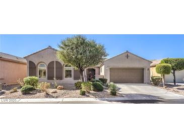Charming single-story home featuring desert landscaping and a two car garage at 5525 Criollo Dr, Las Vegas, NV 89122