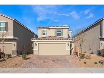 Charming two-story home with a brick-paved driveway and a well-maintained front yard at 7219 Quiet Spring St, North Las Vegas, NV 89084