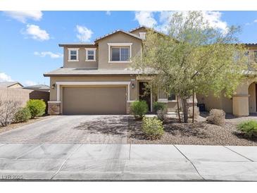 Charming two-story home with a two car garage and well-maintained front yard at 9268 Wildfire Gorge St, Las Vegas, NV 89139