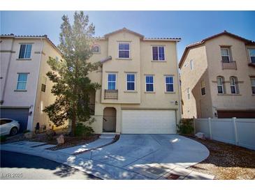 Charming two-story home with a well-manicured lawn and attached two car garage at 1241 Gingerbread Man Ave, Las Vegas, NV 89183