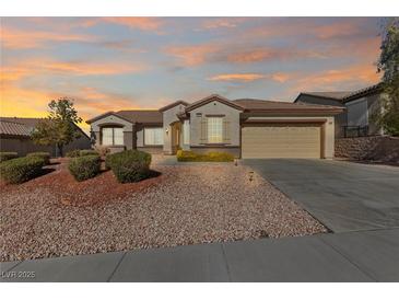 Charming single-story home with low maintenance desert landscaping and a two-car garage at 2920 Foxtail Creek Ave, Henderson, NV 89052
